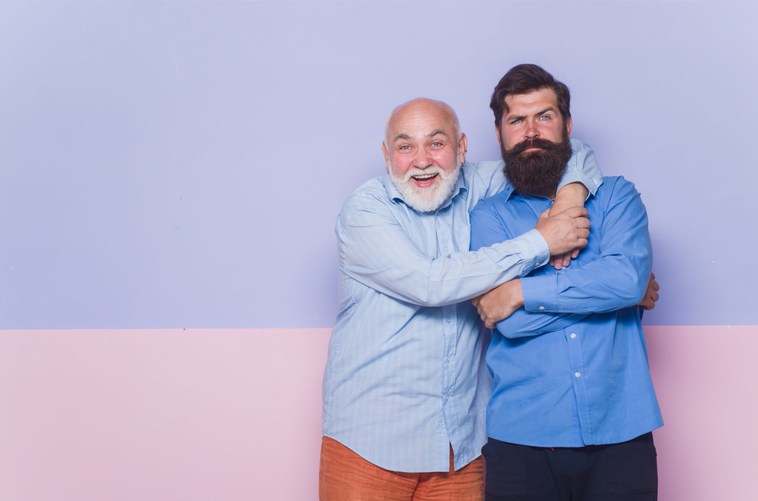 2 generation. Relationships concept. Old dad and young son. Old man and young man. Old dad and adult son. Bearded man. Two bearded man. Advertising. Parentship.
